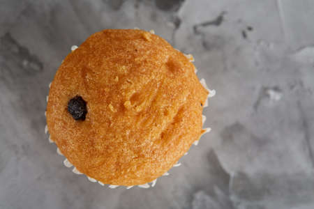 Tasty muffins arranged in pattern on light textured background, close-up, shallow depth of field, selective focus.の写真素材