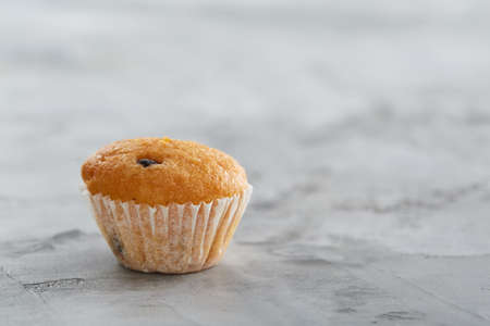 Tasty muffins arranged in pattern on light textured background, close-up, shallow depth of field, selective focus.の写真素材