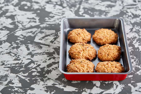 Fresh baked biscuits on a cookie sheet, top view, close-up, selective focus, shallow depth of field.の写真素材