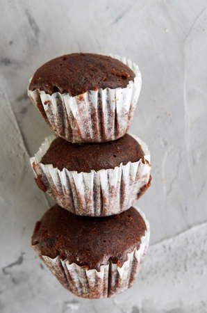 Tasty muffins arranged in pattern on light textured background, close-up, shallow depth of field, selective focus.の写真素材