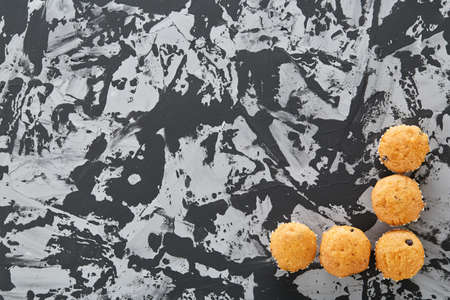 Tasty muffins arranged in pattern on light textured background, close-up, shallow depth of field, selective focus.の写真素材
