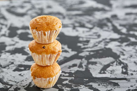 Tasty muffins arranged in pattern on light textured background, close-up, shallow depth of field, selective focus.の写真素材