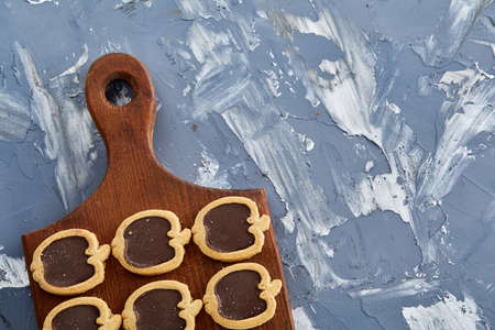 Top view close-up picture of tasty cookies on the cutting board, shallow depth of field, selective focusの写真素材
