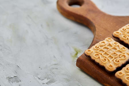 Top view close-up picture of tasty cookies on the cutting board, shallow depth of field, selective focusの写真素材