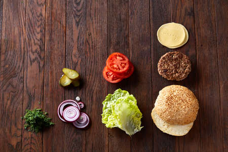 Tasty hamburger ingredients are laid out separately from above, beautifully harmoniously, close-up, top viewの写真素材