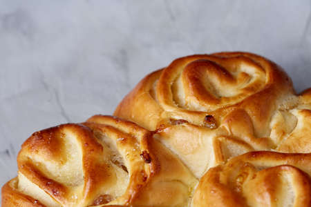 Homemade rose bread on white textured background, close-up, shallow depth of field, top viewの写真素材