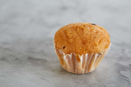 Tasty muffins arranged in pattern on light textured background, close-up, shallow depth of field, selective focus.の写真素材