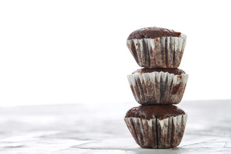 Tasty muffins arranged in pattern on light textured background, close-up, shallow depth of field, selective focus.の写真素材