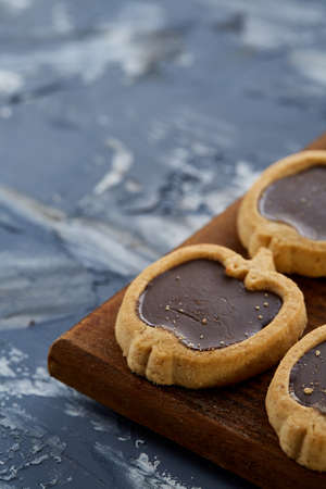 Top view close-up picture of tasty cookies on the cutting board, shallow depth of field, selective...