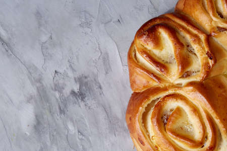 Homemade rose bread on white textured background, close-up, shallow depth of field, top viewの写真素材
