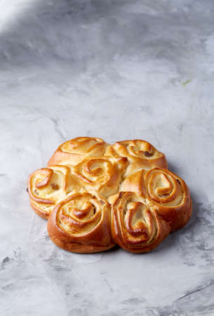 Homemade rose bread on white textured background, close-up, shallow depth of field, top viewの写真素材