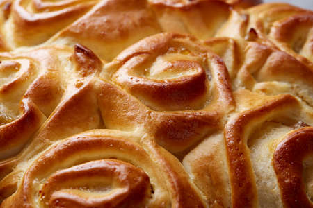 Homemade rose bread on white textured background, close-up, shallow depth of field, top viewの写真素材