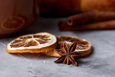 Homemade rose bread, cup of tea, dried citrus and spicies on white textured background, close-up, shallow depth of fieldの写真素材