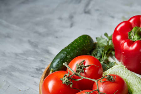 Delicious composition of assorted fresh vegetables and herbs on white textured background, top view, selective focus.の写真素材