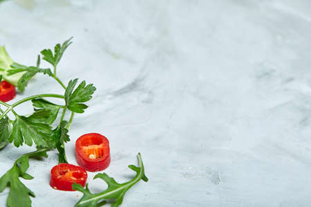 Composition of vegetables and herbs on white background, copy space, selective focus, flat lay, close-upの写真素材