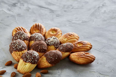 Tasty almond cookies arranged in the shape of fan on white background, close-up, selective focus