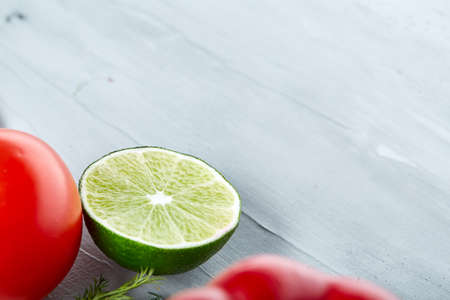 Lime half on white vegetable background, shallow depth of field. cloe-up. Juicy vitamin ingredient. Food background. Gourmet condiment. Preparation for cooking. Healthy lifestyle conceptの写真素材