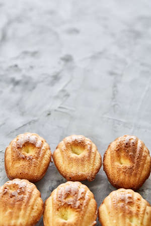 Tasty almond cookies arranged in the shape of fan decorated with almonds on white textured background, close-up, selective focus. Delicious homemade biscuits. Amaretto biscotti. Yummy confectionary. Food concept.の写真素材