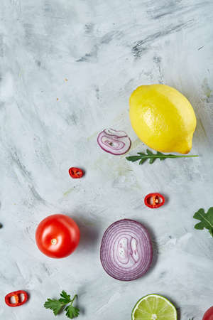 Seamlesly spread chopped onion, red hot pepper and spice isolated on white background, top view, close-up, selective focus. Copy space for your text. Gourmet condiment. Healthy food background.の写真素材