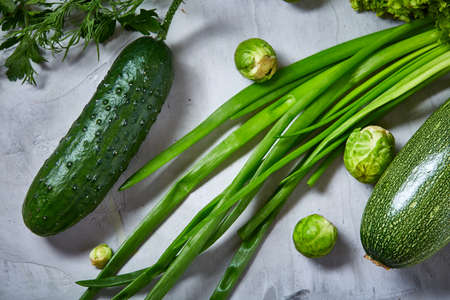 Fresh vegetables still life over white textured background, close-up, flat lay. Assortment of fresh...