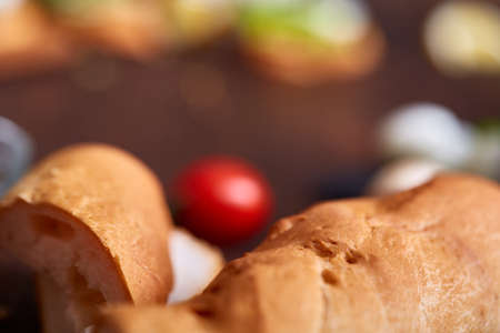 Breakfast still life with sandwiches, quail eggs, spicies and fresh fruits and vegetables on rustic wooden background, selective focus. Gourmet buckish starter. Delicious excuisite appetizer. Sofisticated cuisine. Food concept.の写真素材