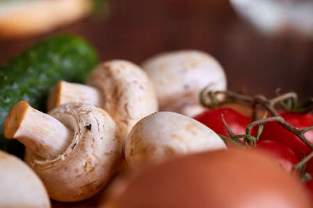 Breakfast still life with sandwiches, quail eggs, spicies and fresh fruits and vegetables on rustic wooden background, selective focus. Gourmet buckish starter. Delicious excuisite appetizer. Sofisticated cuisine. Food concept.の写真素材