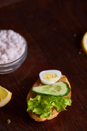 Breakfast still life with sandwiches, quail eggs, spicies and fresh fruits and vegetables, selective...
