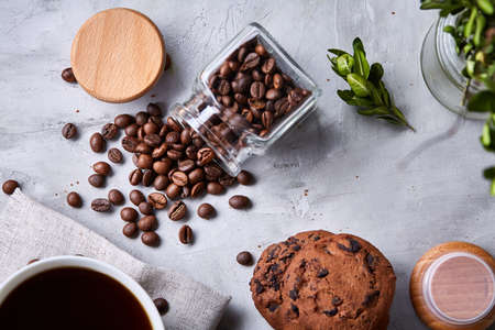 Breakfast background with mug of fresh coffee, homemade oatmeal cookies, grind coffeeの写真素材