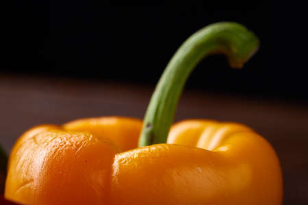 Combination of fresh organic green, yellow and red pepper on rustic wooden background, top view, close-up, selective focus. Heap of organic bell peppers. Studio shot. Fresh tasty salad ingredient. Healthy food concept.の写真素材