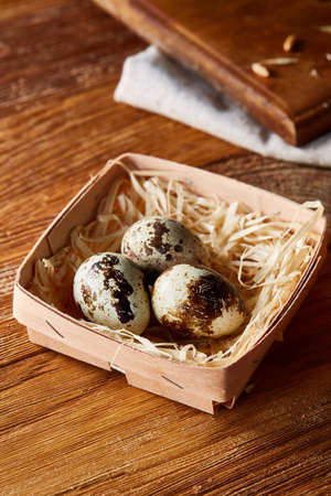 Preparation for making healthy salad with quail eggs, top view, close-up, selective focus. Delicious...