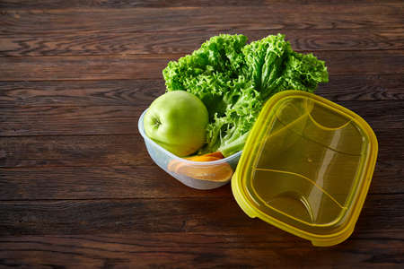 Healthy lunch prepared in small plastic container, top view, close-up.の写真素材