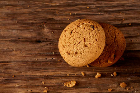 Pile of oat cookies on wooden table, close-up, selective focus.の写真素材
