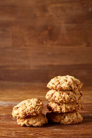Bunch of chocolate biscuits on a rustic wooden background, close-up, selective focus.の写真素材