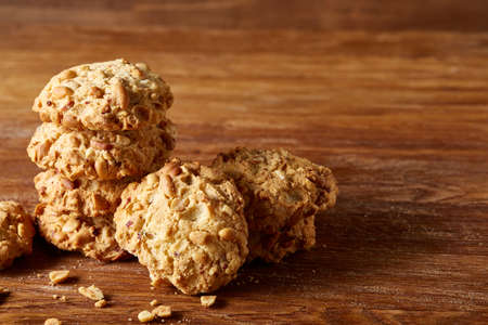 Bunch of chocolate biscuits on a rustic wooden background, close-up, selective focus.の写真素材