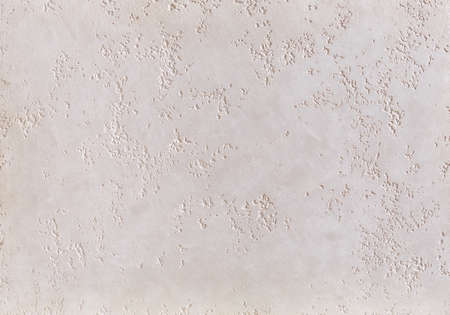 Beige plaster textured background. Abstact beige stucco. Texture of plaster on the wall. Close-up,...