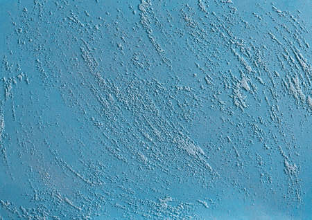 Blue plastered wall background with abstract pattern, close-up, macro. Open space for text, inscription or picture. Indoor or outdoor stucco. Abstract textured rough background. Concrete canvas. Stonewall interior.の写真素材