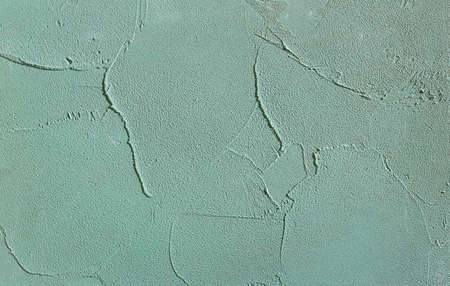 Green rough wall textured background. Abstact stucco. Texture of plaster on the wall. Macro, high...