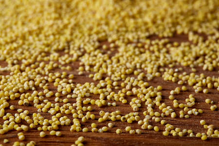 Lentils in a wooden bowl on rustic wooden background, top view, close-up, selective focus. Some copy space for your inscription. Organic protein. Nutrition vegan meal. Healthy food concept. Product for healthy eating and dieting.の写真素材