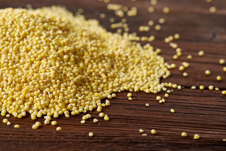 Lentils in a wooden bowl on rustic wooden background, top view, close-up, selective focus. Some copy space for your inscription. Organic protein. Nutrition vegan meal. Healthy food concept. Product for healthy eating and dieting.の写真素材