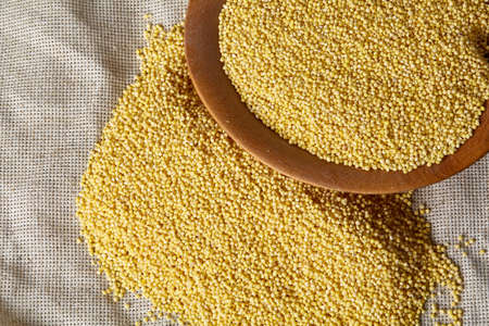 Lentils in a wooden bowl on rustic wooden background, top view, close-up, selective focus. Some copy space for your inscription. Organic protein. Nutrition vegan meal. Healthy food concept. Product for healthy eating and dieting.の写真素材