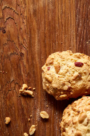 Bunch of chocolate biscuits on a rustic wooden background, close-up, selective focus. Bright gourmet...