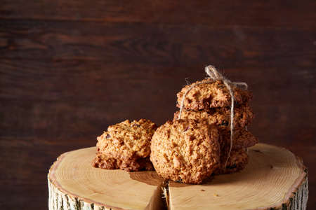Conceptual festive composition with a cup of hot tea, a large set of cookies, cinnamon sticks bunch...