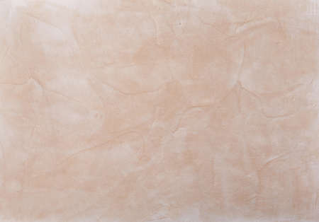 Beige plaster textured background. Abstact beige stucco. Texture of plaster on the wall. Close-up,...