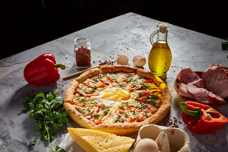 Tasty Italian pizza and its ingredients on white textured background.