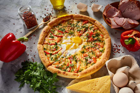 Tasty Italian pizza and its ingredients on white textured background, top view, close-up, selective focus. Delicious snack. Traditional homemade Italian pizza. Mediterranian cuisine. Fast food concept.の写真素材