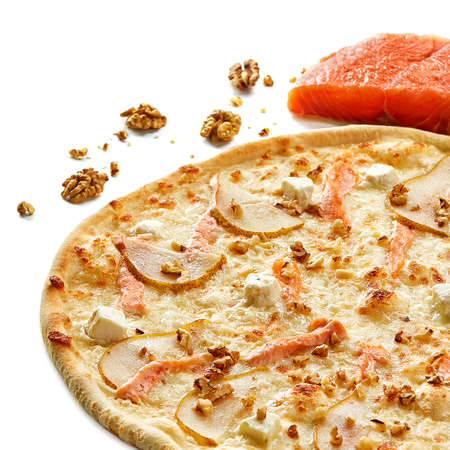 Pizza with seafood, mozzarella, salmon, pear and hazelnut isolated on white background, top view, close-up, selective focus. Exotic Italian pizza. Delicious cheesy snack. Fast food concept.の写真素材