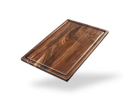 dark wooden cutting board isolated on a whiteの写真素材
