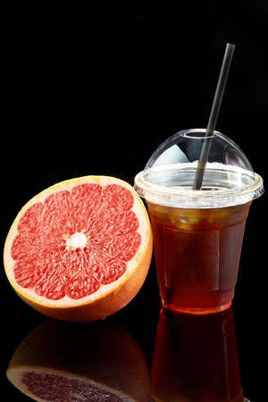 Grapefruit fresh in a plastic transparent takeaway glassの写真素材
