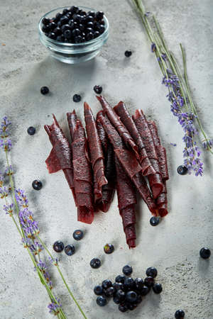 Fruit marshmallow. Berry pastille on light background. Pastille fruit rollsの写真素材