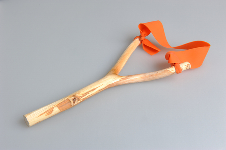 Handmade slingshot on gray backgroundの写真素材